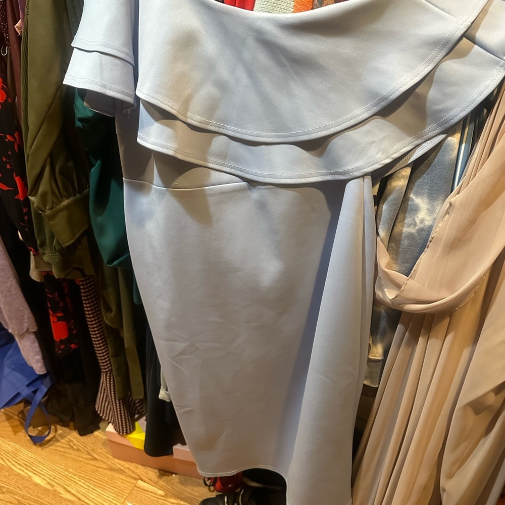 Light blue dress brand new with the tag size 14 stretchable brand ASOS